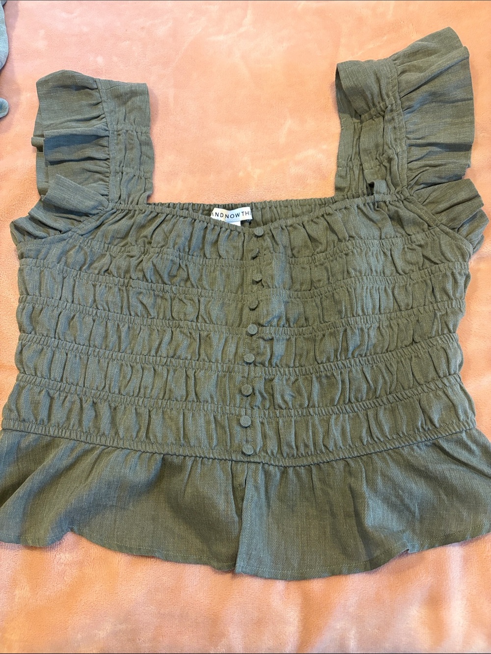 Smocked Ruffle Sleeve Blouse in Olive by ANDNOWTH